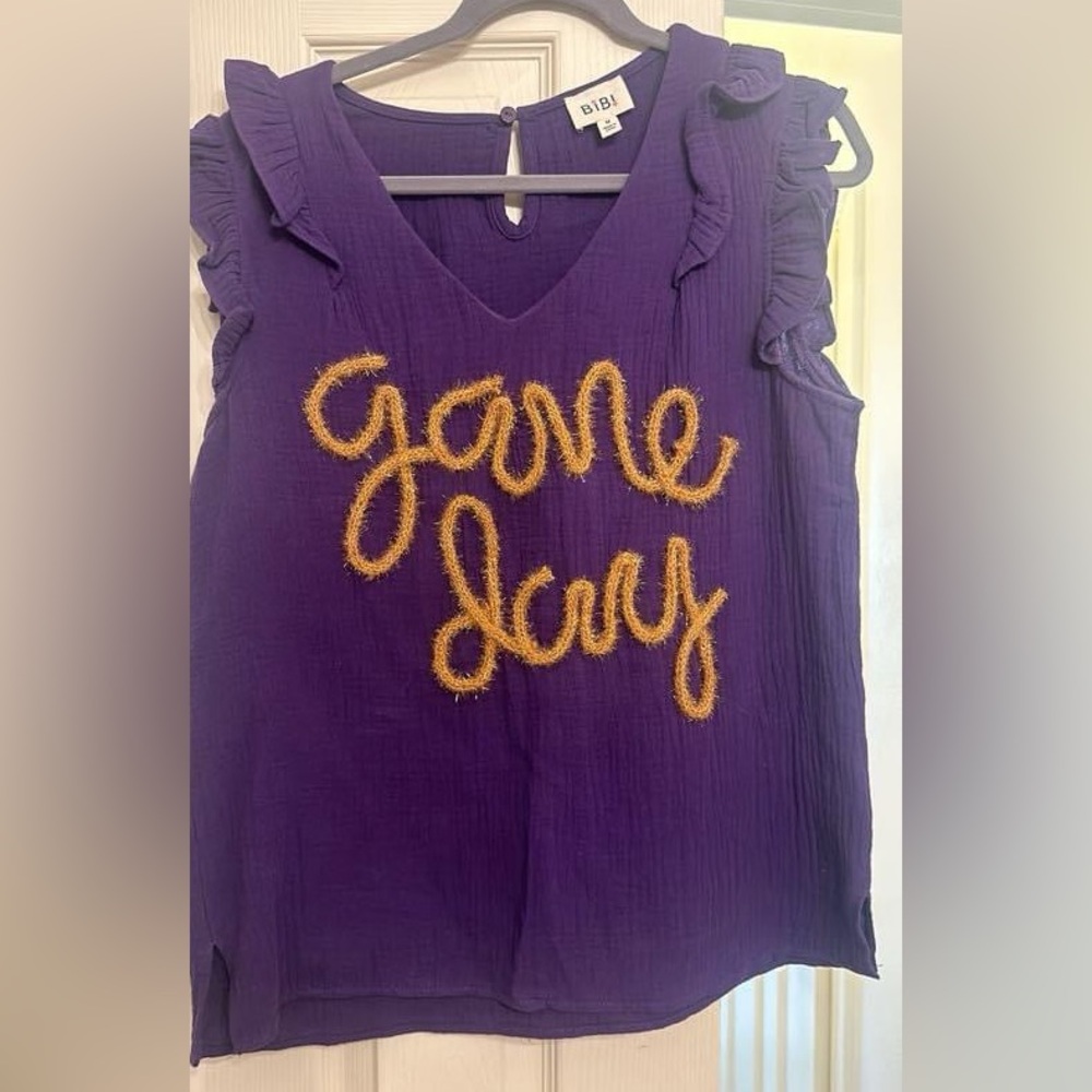 Game day tinsel writing top size medium worn twice dry cleaned LSU